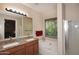 Bathroom features double sinks, soaking tub, and separate shower, designed for relaxation and functionality at 2614 W Fawn Dr, Phoenix, AZ 85041