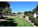 Manicured community green space offering a tranquil environment with mature trees and well-maintained landscaping at 2614 W Fawn Dr, Phoenix, AZ 85041