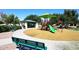Community playground featuring a slide, climbing structures, and shaded seating area, perfect for Gathering fun at 2614 W Fawn Dr, Phoenix, AZ 85041