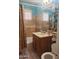 Bathroom with a shower-tub combination, light brown tile, vanity, and sink at 3041 E Osborn Rd, Phoenix, AZ 85016