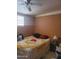 Modest bedroom featuring brick accent wall and a ceiling fan at 3041 E Osborn Rd, Phoenix, AZ 85016