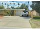 Charming single-story home featuring a spacious driveway and well-maintained landscaping at 3041 E Osborn Rd, Phoenix, AZ 85016