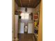 Cozy laundry room equipped with washer, dryer, and storage shelving at 3041 E Osborn Rd, Phoenix, AZ 85016