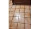 Close-up of tiled floor, showcasing its neutral color and clean lines, complemented by wooden furniture at 3041 E Osborn Rd, Phoenix, AZ 85016