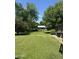 Lush backyard with mature trees providing shade and privacy; an ideal setting for outdoor enjoyment at 313 E 15Th St, Tempe, AZ 85281