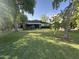 Charming single-story home featuring a lush green lawn and mature trees at 313 E 15Th St, Tempe, AZ 85281