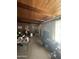 Living room with wood paneled walls, wood ceiling, and a glimpse down the hallway at 313 E 15Th St, Tempe, AZ 85281
