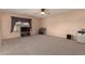 Spacious carpeted bedroom featuring a ceiling fan and large window at 3443 W Saint Anne Ave, Phoenix, AZ 85041