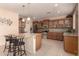 Open concept kitchen with tile floors, stainless steel appliances, and center island at 3443 W Saint Anne Ave, Phoenix, AZ 85041