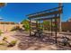 Paver patio includes pergola and lush landscaping at 3443 W Saint Anne Ave, Phoenix, AZ 85041