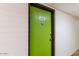 Condominium front door in a secure building featuring keycard access and unit number A-112 at 357 E Thomas Rd # A112, Phoenix, AZ 85012