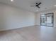 Bright bedroom with light wood flooring and access to the backyard patio at 3950 E Augusta Ave, Queen Creek, AZ 85142