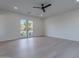 Bright bedroom with light wood flooring and doors that lead to the outdoor space at 3950 E Augusta Ave, Queen Creek, AZ 85142