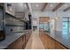 Gorgeous kitchen with stainless appliances, stone countertops, an expansive island, and open access to an adjacent room at 3950 E Augusta Ave, Queen Creek, AZ 85142