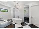 Bright bathroom features a soaking tub, dual sink vanity, and a walk in shower with black accents at 3950 E Augusta Ave, Queen Creek, AZ 85142