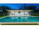 Beautiful swimming pool with a stunning waterfall feature and well-equipped outdoor kitchen at 3950 E Augusta Ave, Queen Creek, AZ 85142