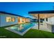 Beautiful pool area with a covered outdoor kitchen and spa, perfect for relaxation and entertaining at 3950 E Augusta Ave, Queen Creek, AZ 85142