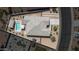 Overhead view of a private backyard with a pool, covered patio, and desert landscaping at 4001 N 300Th Ln, Buckeye, AZ 85396