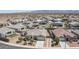 Neighborhood aerial view showcasing single-Gathering homes, desert landscaping, solar panels, and block wall fences at 4001 N 300Th Ln, Buckeye, AZ 85396