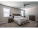 Cozy bedroom featuring a neutral color scheme, ceiling fan, and plush carpeting at 4001 N 300Th Ln, Buckeye, AZ 85396