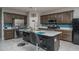 Stylish kitchen featuring a center island, stainless steel appliances, and modern finishes at 4001 N 300Th Ln, Buckeye, AZ 85396