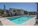 A pristine pool with a storage shed and lounge chairs offers a relaxing outdoor space at 4001 N 300Th Ln, Buckeye, AZ 85396