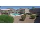 A sparkling pool features a storage shed, landscaping, and lounge seating at 4001 N 300Th Ln, Buckeye, AZ 85396