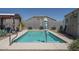 A lovely pool area with a covered patio, landscaping, and a storage shed at 4001 N 300Th Ln, Buckeye, AZ 85396