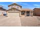 Charming two-story home featuring a well-manicured front yard and a two-car garage at 4118 W Fallen Leaf Ln, Glendale, AZ 85310