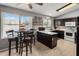 Efficient kitchen featuring white countertops, dark cabinets and views to the neighborhood at 4118 W Fallen Leaf Ln, Glendale, AZ 85310