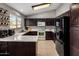 Functional kitchen showcasing ample counter space and dark cabinetry at 4118 W Fallen Leaf Ln, Glendale, AZ 85310