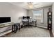Bright office space features wood floors, a large window, and 2 workstations, perfect for remote work or study at 4118 W Fallen Leaf Ln, Glendale, AZ 85310