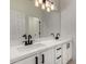 Contemporary bathroom with marble countertop and black hardware at 4216 N Dania Ct, Litchfield Park, AZ 85340