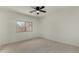 Inviting bedroom features wood-look tile flooring and a ceiling fan at 4216 N Dania Ct, Litchfield Park, AZ 85340