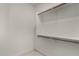Walk-in closet with shelving and copper hardware at 4216 N Dania Ct, Litchfield Park, AZ 85340