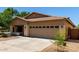 Charming single-story home featuring a well-maintained front yard and a two-car garage at 4216 N Dania Ct, Litchfield Park, AZ 85340