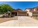 Charming single-story home featuring a well-maintained front yard and a two-car garage at 4216 N Dania Ct, Litchfield Park, AZ 85340
