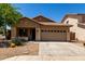 Charming single-story home featuring a well-maintained front yard and a two-car garage at 4216 N Dania Ct, Litchfield Park, AZ 85340