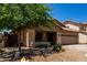 Charming single-story home featuring a well-maintained front yard and a two-car garage at 4216 N Dania Ct, Litchfield Park, AZ 85340