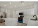 Beautiful kitchen with white cabinetry, stainless appliances, and center island at 4216 N Dania Ct, Litchfield Park, AZ 85340