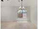 Bright and airy living room featuring tile floors and a large window at 4216 N Dania Ct, Litchfield Park, AZ 85340