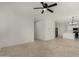 Spacious living room with tile flooring leading to the kitchen at 4216 N Dania Ct, Litchfield Park, AZ 85340