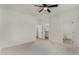 Main bedroom features wood-look tile flooring and ensuite bathroom at 4216 N Dania Ct, Litchfield Park, AZ 85340