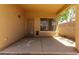 Covered patio featuring a security door and an outdoor ceiling fan at 4216 N Dania Ct, Litchfield Park, AZ 85340
