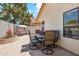 Backyard features a dining table with chairs and a swing, perfect for outdoor entertaining at 4420 E Amberwood Dr, Phoenix, AZ 85048