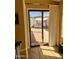View of a cozy backyard patio featuring a swing and privacy fencing, accessible through a sliding glass door at 4420 E Amberwood Dr, Phoenix, AZ 85048