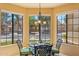 Cozy breakfast nook with bay windows offering a view of the front yard and neighborhood at 4420 E Amberwood Dr, Phoenix, AZ 85048
