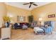 Spacious living room with vaulted ceilings, hardwood floors, and stylish furnishings at 4420 E Amberwood Dr, Phoenix, AZ 85048