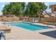 Sparkling community pool featuring clear water, poolside lounge chairs, and a 'No Diving' sign for safety in shallow water at 4420 E Amberwood Dr, Phoenix, AZ 85048