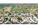 Wide aerial view of the community featuring landscaped surroundings, a golf course, and a tranquil lake at 4525 N 66Th St # 85, Scottsdale, AZ 85251